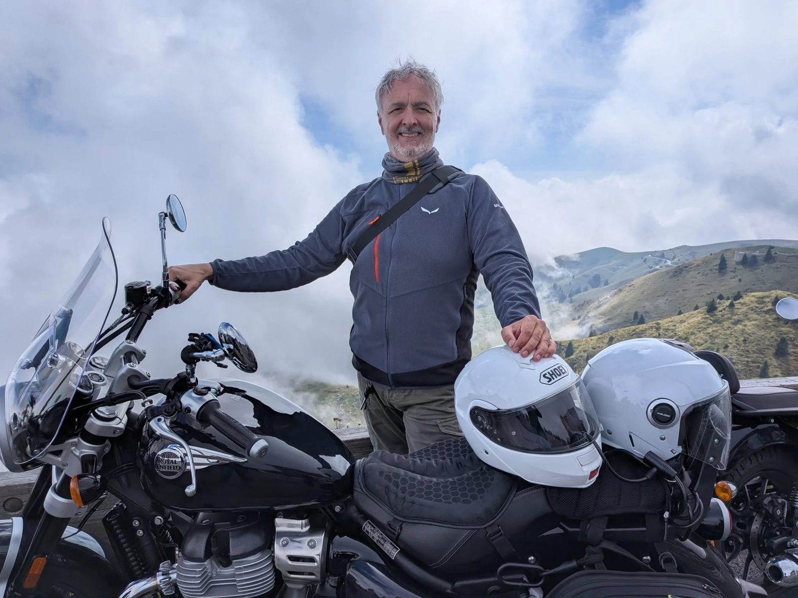 Andrea Boschin with his motorcycle on a mountain road